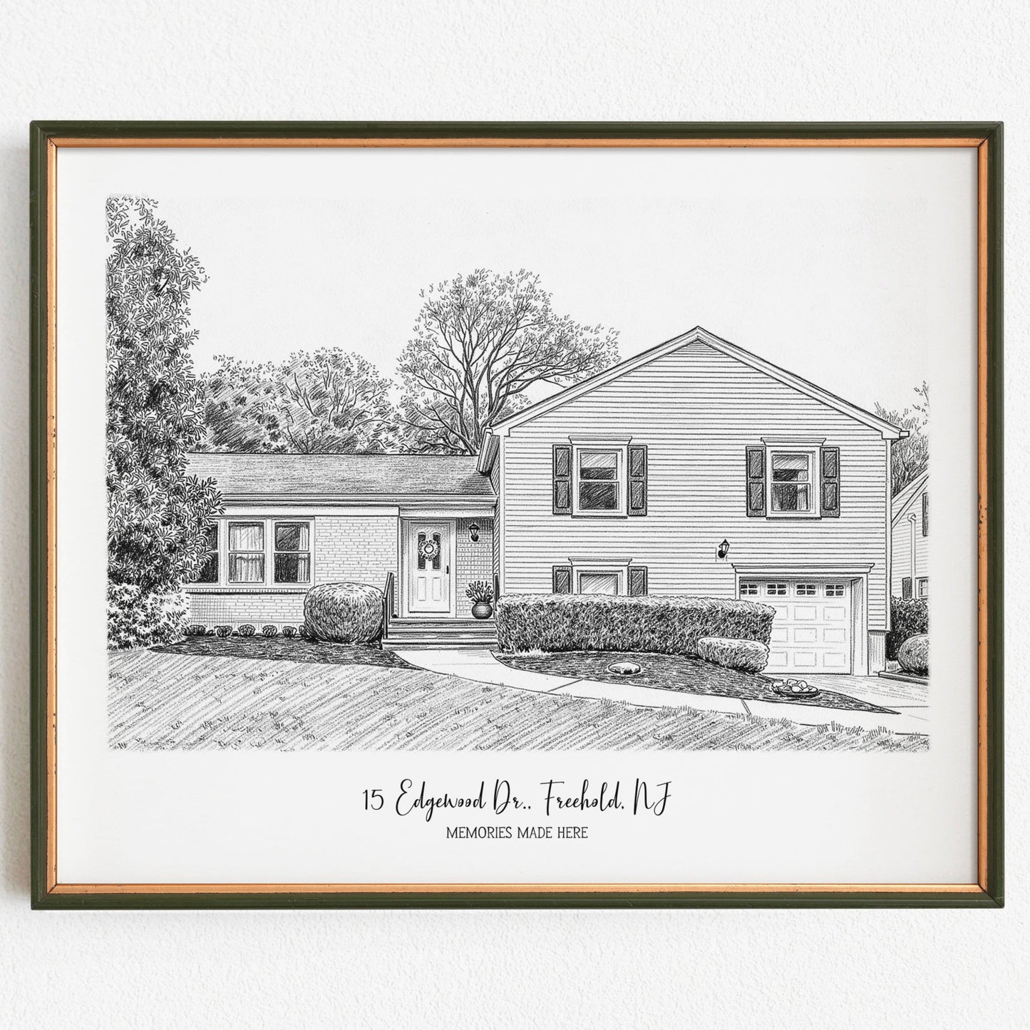 Framed black and white drawing of a house with text on a white background