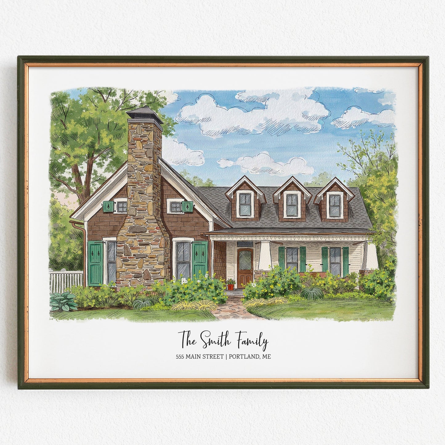 Framed artwork of a house with 'The Smith Family' text on a white background